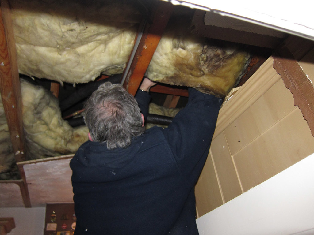 Tradesperson working on plumbing